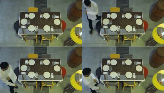现代餐厅的服务员正在准备餐桌高清在线视频素材下载