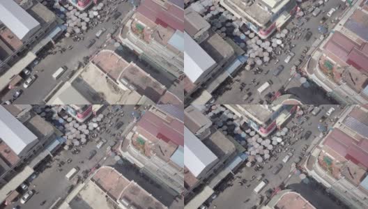 从空中俯瞰拥挤的街道上的水果和蔬菜市场高清在线视频素材下载