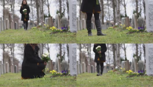 在墓地里参观坟墓的妇女高清在线视频素材下载