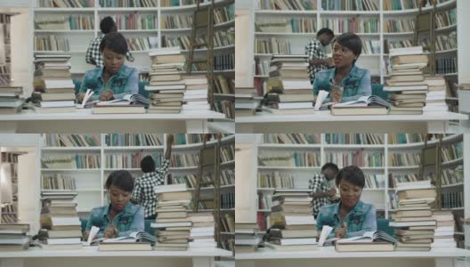 专心致志的非洲妇女在图书馆看书高清在线视频素材下载