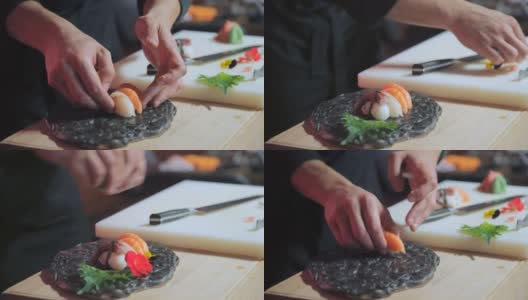厨师的手在寿司盘上摆放手握寿司高清在线视频素材下载