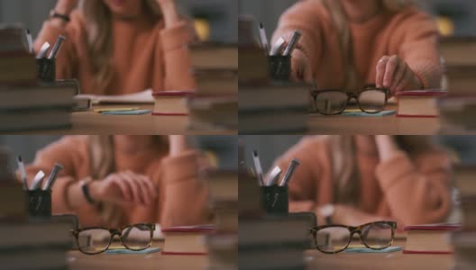 一个女人在学习时摘掉眼镜的4k视频高清在线视频素材下载