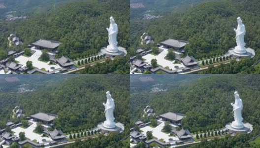 香港大埔，白天，鸟瞰山上巨大的观音雕像高清在线视频素材下载