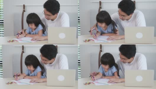 慢镜头的父亲教他的小女儿画画高清在线视频素材下载