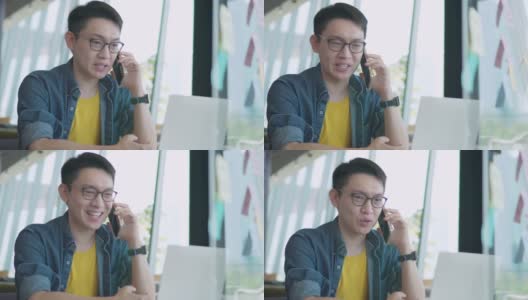 特写英俊的亚洲年轻人在使用笔记本电脑聊天，使用网络摄像头，户外技术工作互联网。他正在家里开视频会议高清在线视频素材下载
