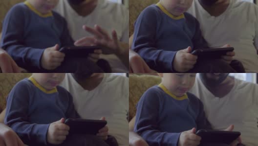 爸爸教可爱的儿子如何刷手机高清在线视频素材下载