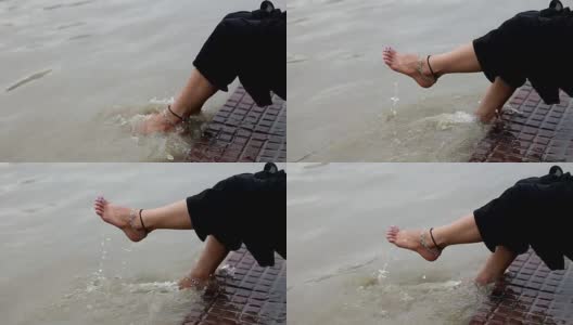 女人光着脚，河水淙淙高清在线视频素材下载