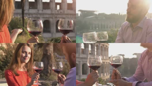 日落时分，一对浪漫的情侣坐在罗马斗牛场前的餐厅桌前，喝着红酒敬酒高清在线视频素材下载