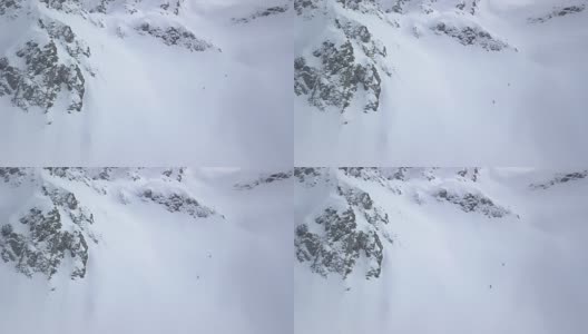 乡间滑雪者下山，积着厚厚的粉雪高清在线视频素材下载