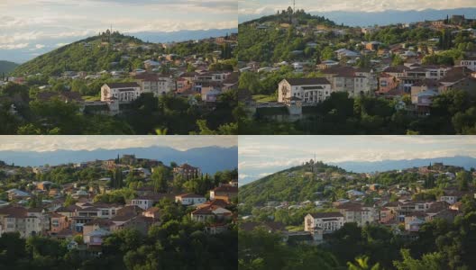 西格尼镇，格鲁吉亚村庄的房子和绿色的树在山的背景高清在线视频素材下载