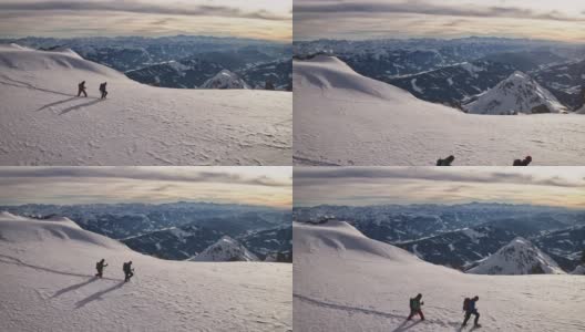 成熟的男人在白雪覆盖的悬崖上徒步旅行高清在线视频素材下载