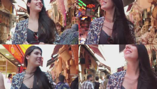 一个快乐的女人在土耳其伊斯坦布尔的街市上闲逛高清在线视频素材下载