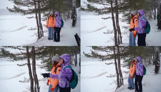 年轻女子在冬天探索令人惊叹的森林高清在线视频素材下载