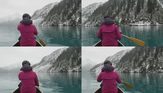 女性冒险家皮划艇高山湖泊高清在线视频素材下载