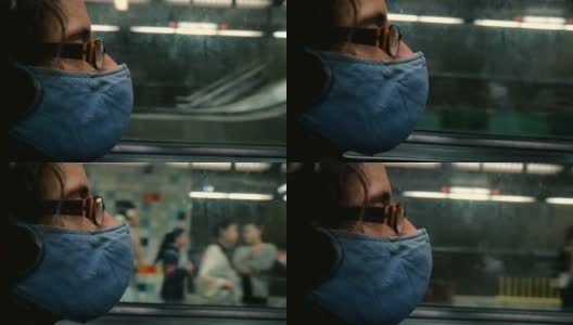 一名戴着呼吸面罩的男子到达地铁站高清在线视频素材下载