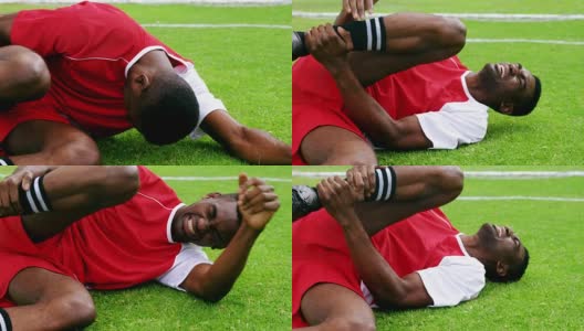 受伤的足球运动员躺在草地上高清在线视频素材下载