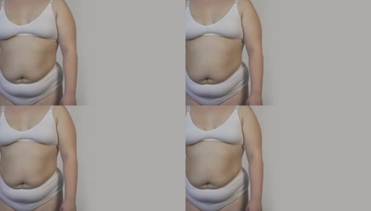 胖女士穿着内衣站在镜头前，统计数据，抽脂高清在线视频素材下载