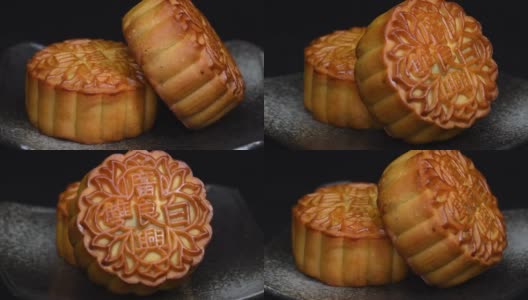 中秋节期间向朋友或家庭聚会提供月饼/月饼和中国茶/月饼上的汉字代表“重白”的英文高清在线视频素材下载