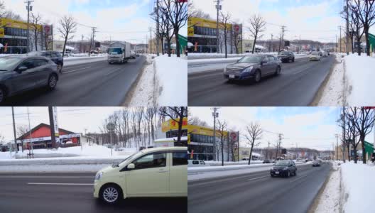 日本札幌市早上的道路和交通上都下着雪高清在线视频素材下载