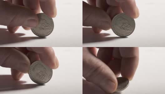 手握2德国马克硬币背面肖像库尔特舒马赫。高清在线视频素材下载