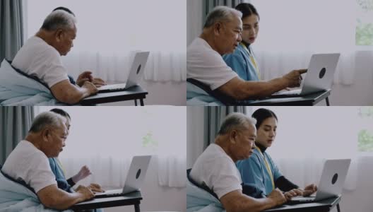 护士帮老人拿笔记本电脑的侧影。高清在线视频素材下载