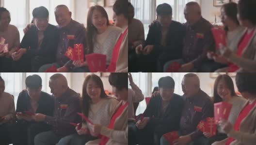 春节孙子们祝福收到红包的祖父母兴旺和幸运高清在线视频素材下载