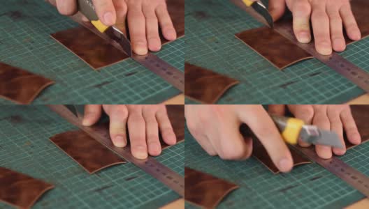 皮革匠的手的近距离测量和切割皮革与刀。生产手工皮具。爱好的概念。缓慢的运动。高清在线视频素材下载