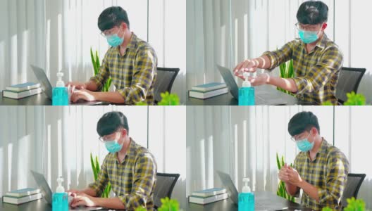 “商人佩戴防护口罩、使用洗手液在办公室工作杀灭covid-19、预防感染和大流行”的4k视频画面高清在线视频素材下载