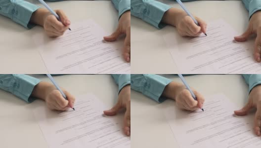 手在纸上用笔签合同高清在线视频素材下载