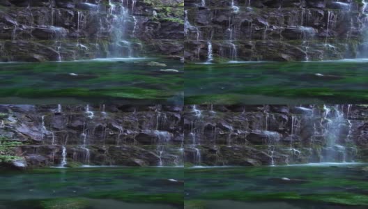 瀑布般的天然瀑布，由山泉倾泻而出高清在线视频素材下载