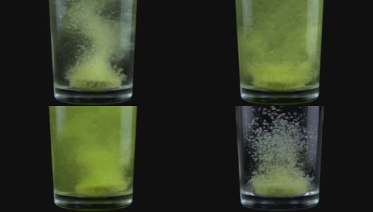 将一片维生素C药片倒入一个透明的玻璃玻璃杯中，加入水。这起泡的黄色药片溶化了。黑色背景上的玻璃。缓慢的运动。近距离高清在线视频素材下载