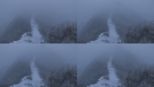 雪景中的中国长城，云雾中的自然风光(延时)高清在线视频素材下载