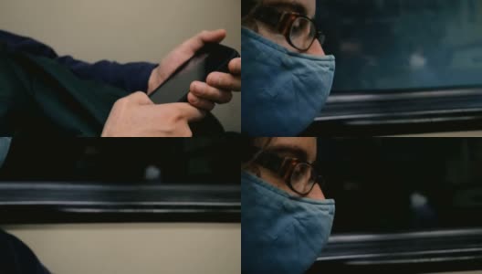 一名戴着呼吸面罩的男子在地铁上使用手机高清在线视频素材下载