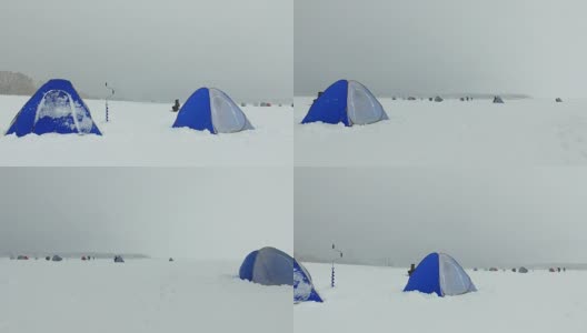 冬季在西伯利亚捕鱼-渔民的帐篷在冰Ob水库在新西伯利亚，俄罗斯高清在线视频素材下载