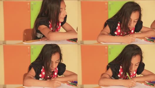 可爱的小女孩用彩色铅笔画画高清在线视频素材下载