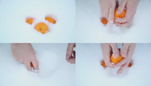 一个男人正在把橘子从雪地上擦去。高清在线视频素材下载