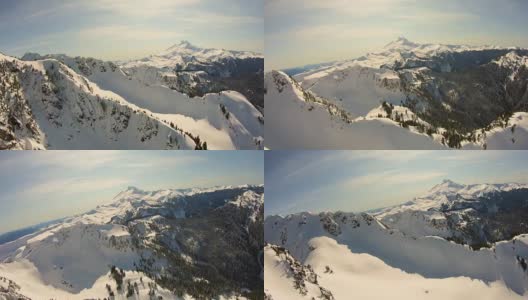 山贝克斯诺夸尔米森林冬季空中直升机角度飞行在陡峭的悬崖峭壁带新鲜雪景偏远的荒野位置高清在线视频素材下载