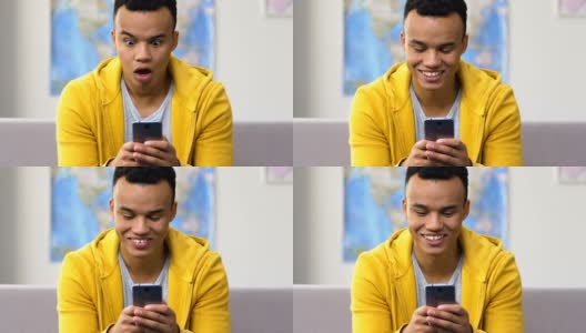 惊讶的黑人高中生浏览智能手机，现代约会社交应用高清在线视频素材下载