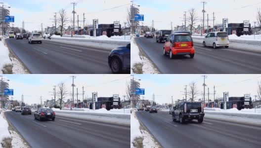 日本札幌市早上的道路和交通上都下着雪高清在线视频素材下载