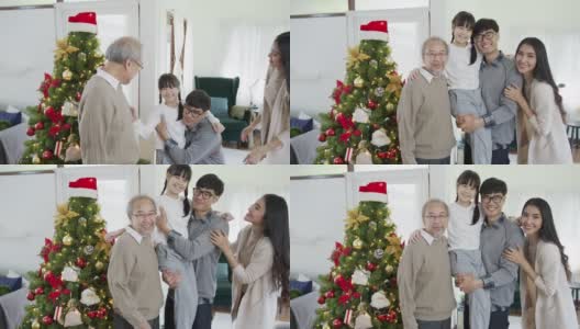 幸福的亚洲三代家庭在检疫圣诞快乐享受拍照拍摄合影合影站在家里公寓享受闲暇时间与圣诞树。高清在线视频素材下载