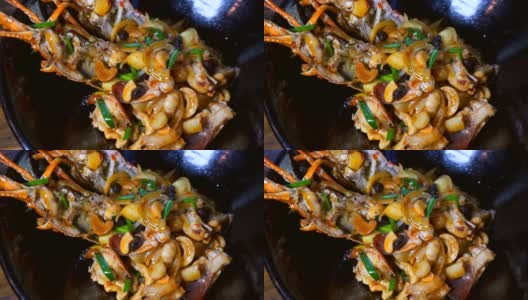 豪华餐厅的烤龙虾配蔬菜，黑盘腰果高清在线视频素材下载