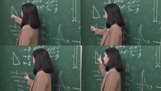 年轻的亚洲女教师与学生在摄像机视频会议上讲话。女教师在课堂上培训数学黑板在线课程。高清在线视频素材下载