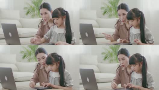 母亲与老师讨论女儿的在线学习问题。高清在线视频素材下载