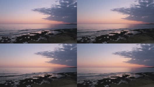塞浦路斯岛上阿伊亚纳帕海滩上阳光的浪漫粉色反射高清在线视频素材下载