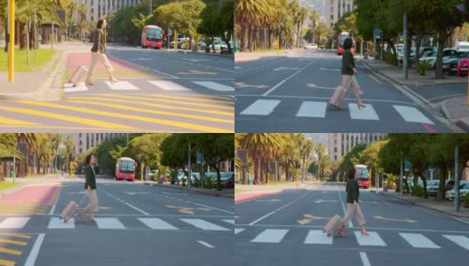 一段4k的视频，一个漂亮的年轻女子带着她的行李在城市外面过马路高清在线视频素材下载