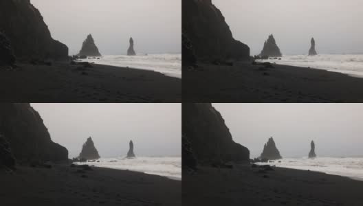 在冰岛的黑色沙滩上，阴沉的大风天高清在线视频素材下载