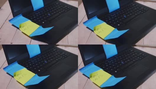 笔记本电脑上写满了笔记和备忘录高清在线视频素材下载
