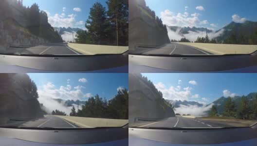 从汽车的挡风玻璃上看，莱达加泰罗尼亚比利牛斯山脉之间的一条柏油路高清在线视频素材下载