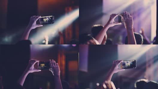 在音乐会上拿着智能手机的女人的手高清在线视频素材下载