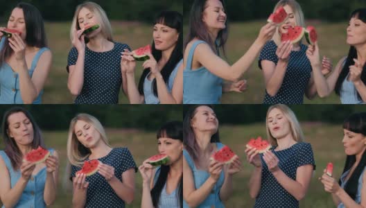 日落时分，三个年轻迷人的女性朋友在吃着西瓜，面带微笑。高清在线视频素材下载